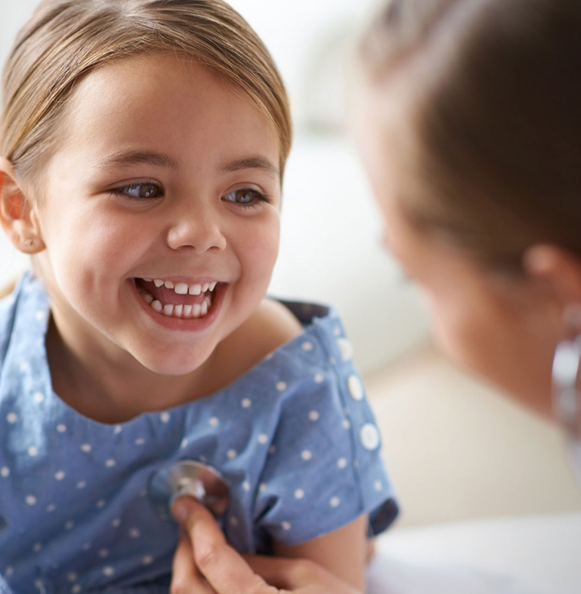 Image of pediatrician treating little girl